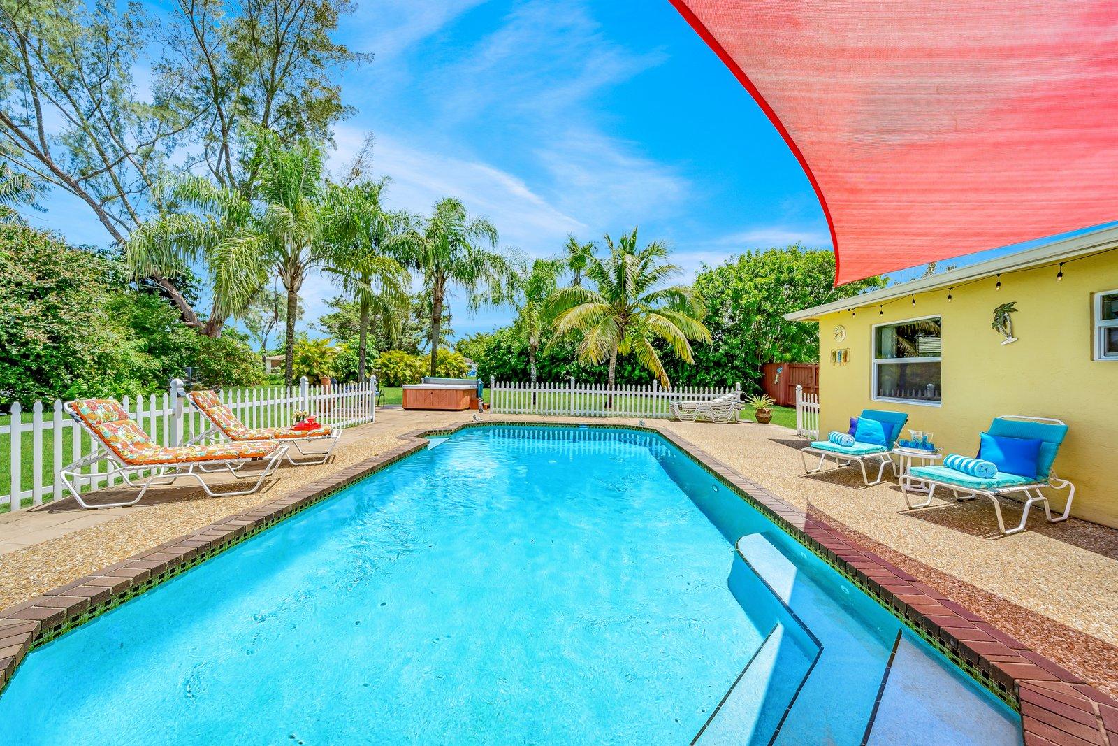 22206 Aquila Street Boca Raton, FL 33428 - Photo 51 of 73 a view of a house with swimming pool and sitting area