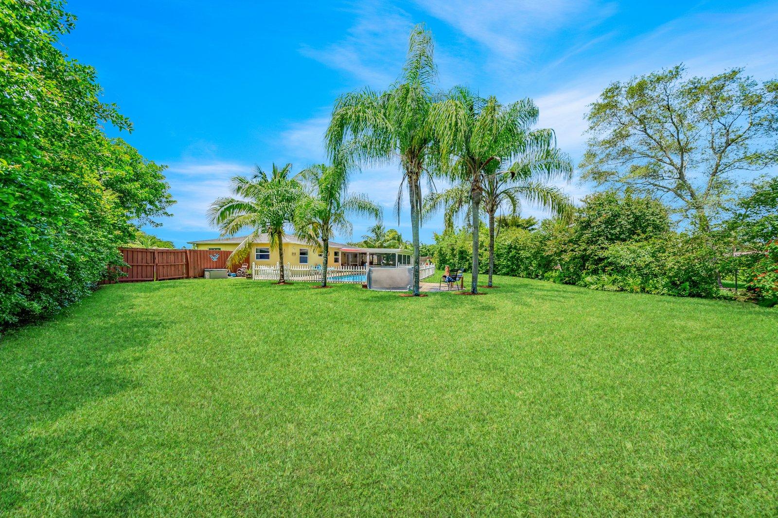 22206 Aquila Street Boca Raton, FL 33428 - Photo 6 of 73 a view of building with garden