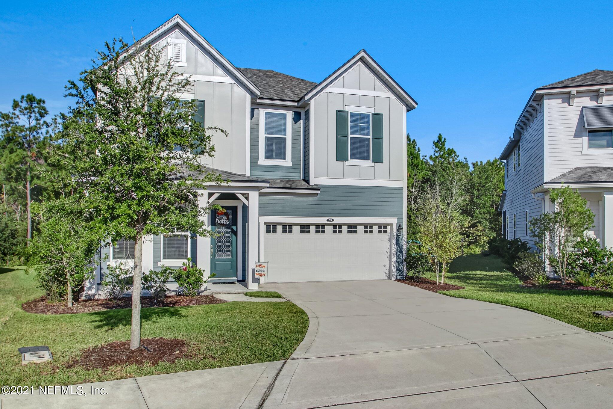 33 Adler Place St. Johns, FL 32259 - Photo 2 of 82 a front view of a house with garden