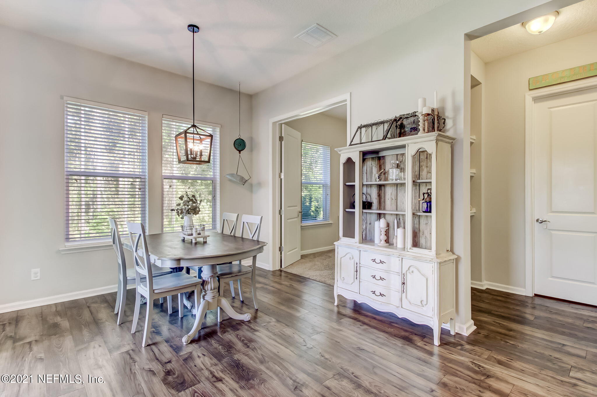 33 Adler Place St. Johns, FL 32259 - Photo 12 of 82 a dining room with furniture window and wooden floor