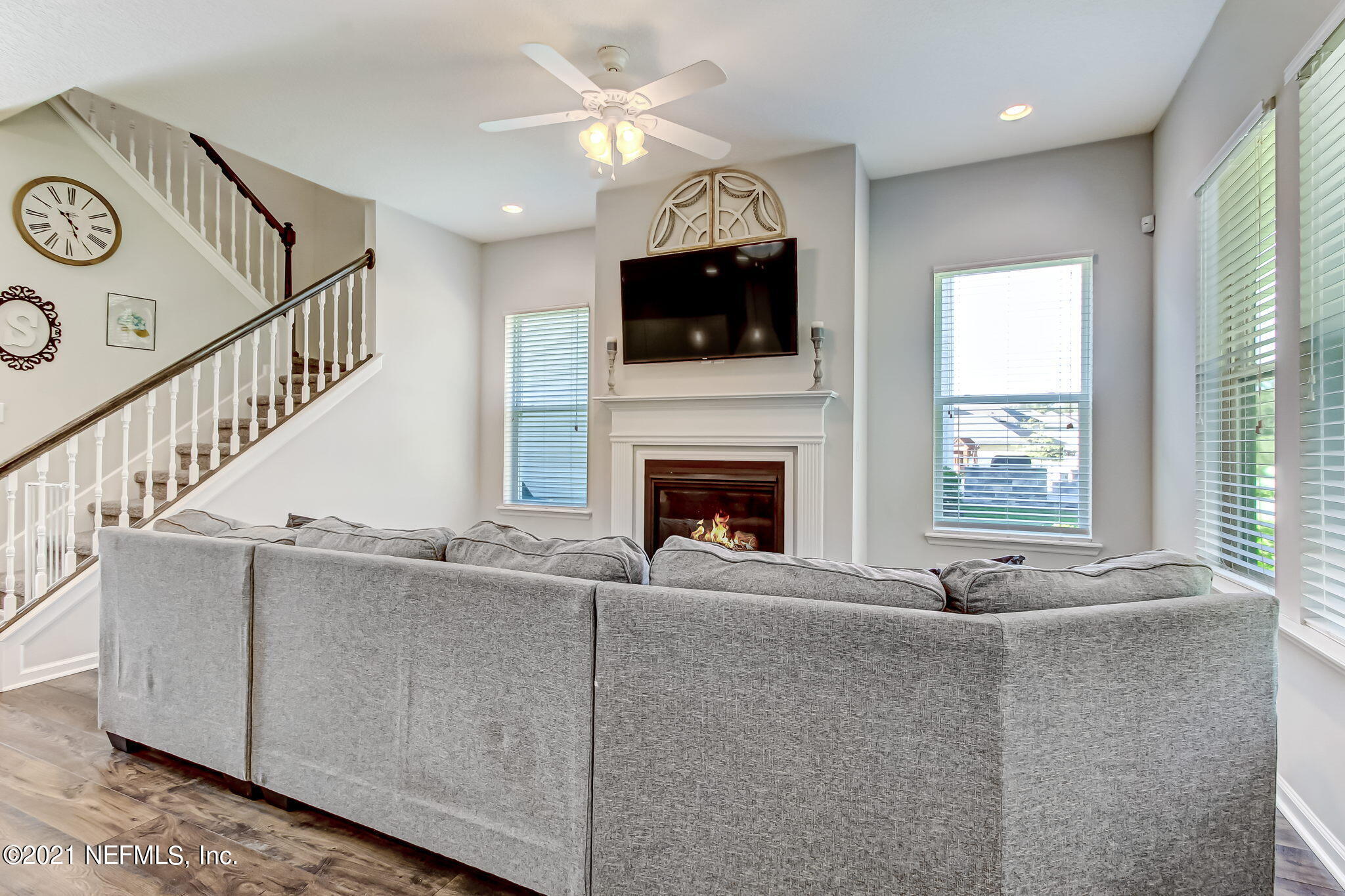 33 Adler Place St. Johns, FL 32259 - Photo 16 of 82 a living room with fireplace furniture and a flat screen tv