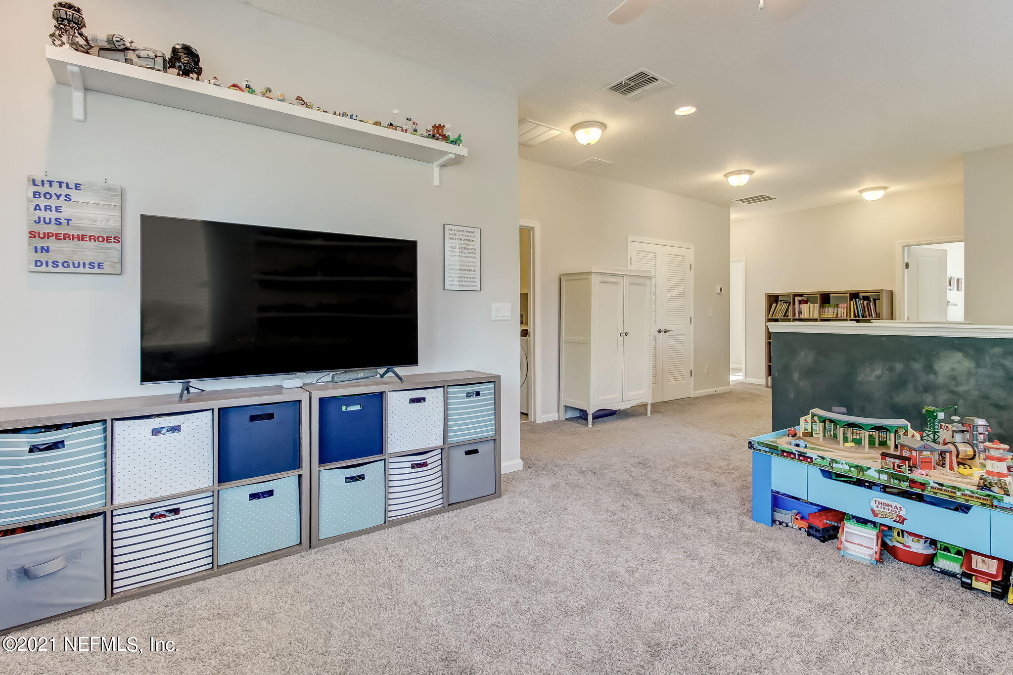 33 Adler Place St. Johns, FL 32259 - Photo 24 of 82 a living room with furniture and a flat screen tv
