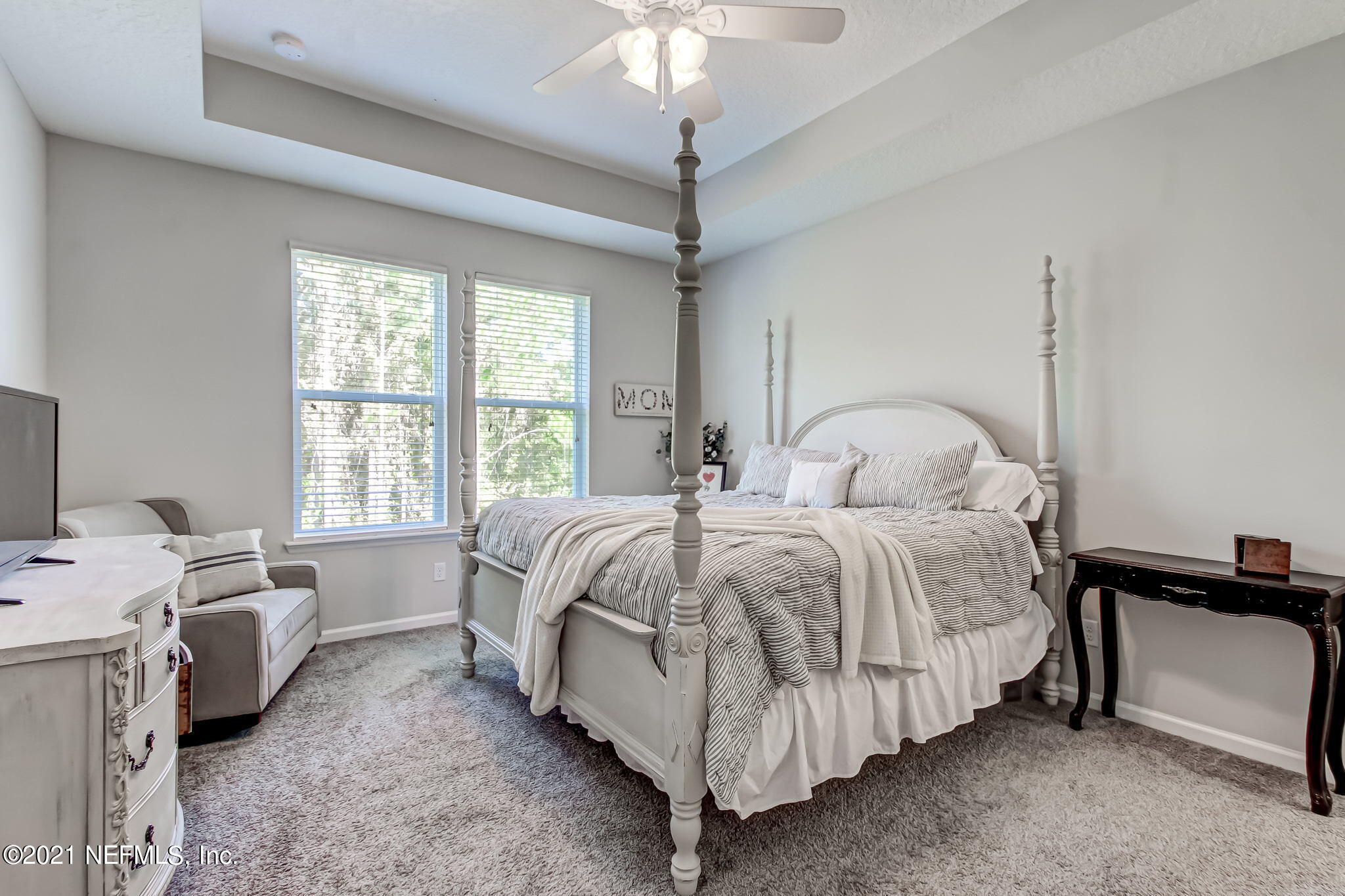 33 Adler Place St. Johns, FL 32259 - Photo 25 of 82 a bedroom with a bed and a chandelier