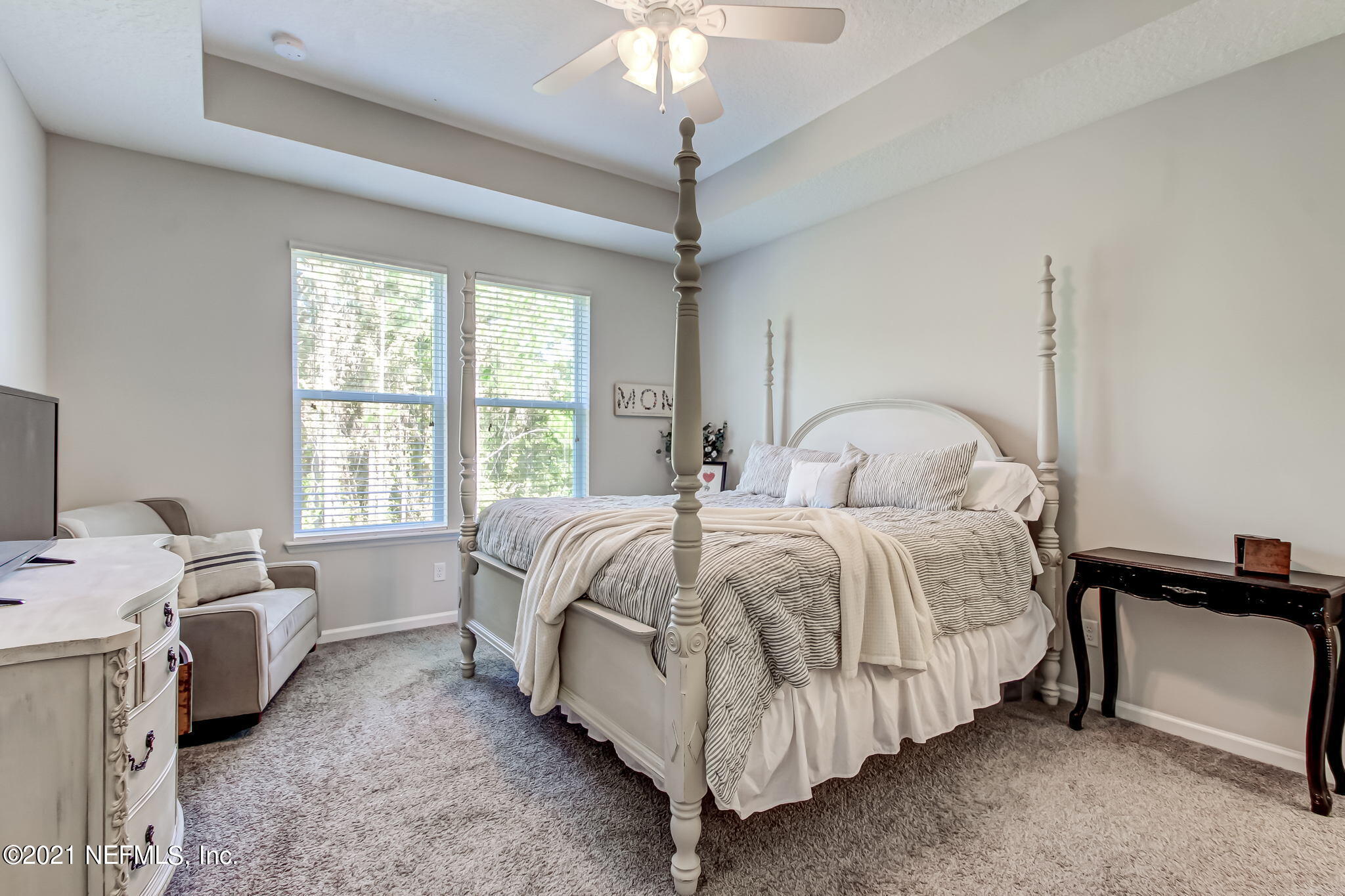 33 Adler Place St. Johns, FL 32259 - Photo 26 of 82 a bedroom with a bed and a chandelier
