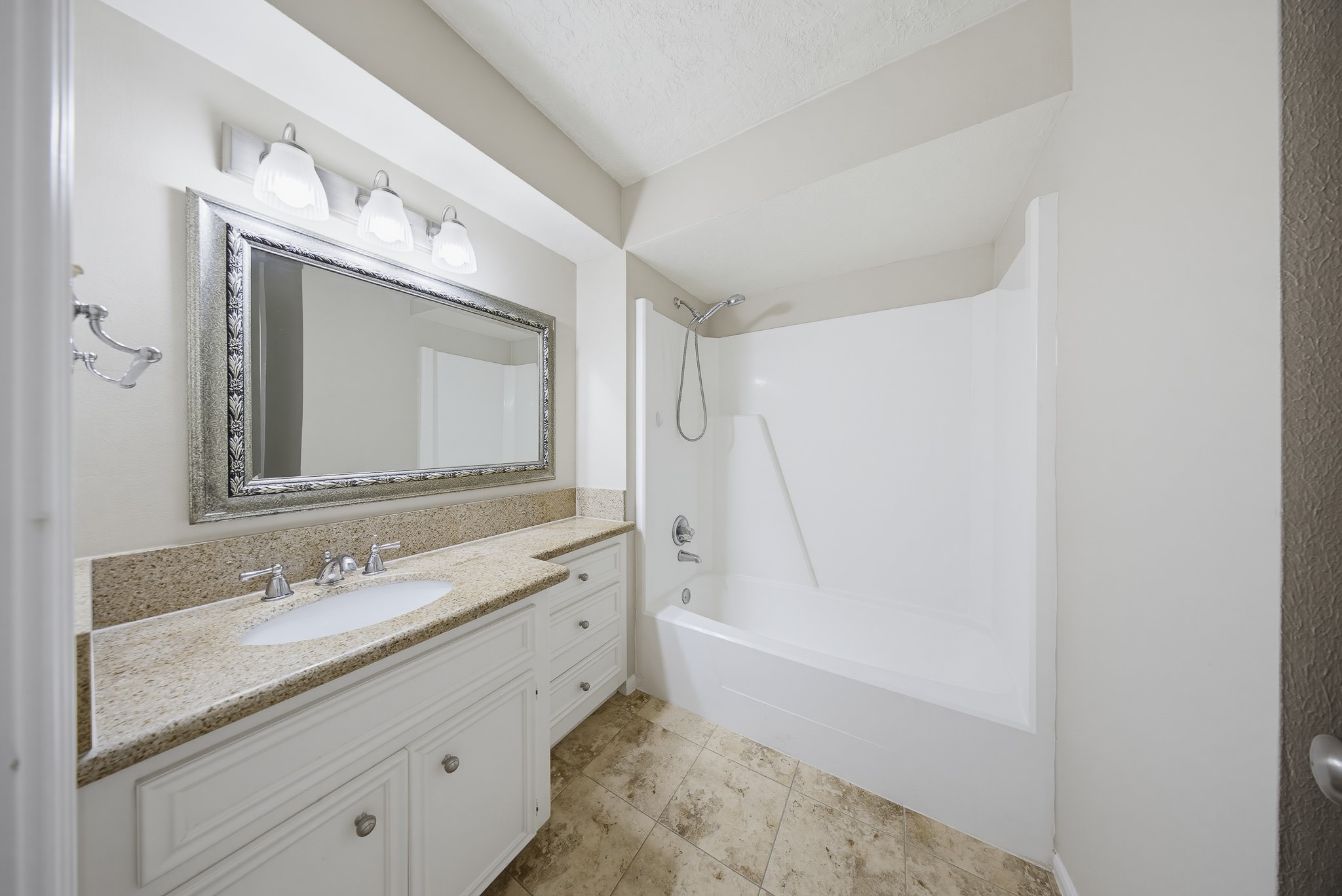 727 Bunker Hill Road, Unit 34 Houston, TX 77024 - Photo 30 of 38 Full secondary bath shared by the upstairs bedrooms. Like the ensuite bath, it also boasts a classic design.