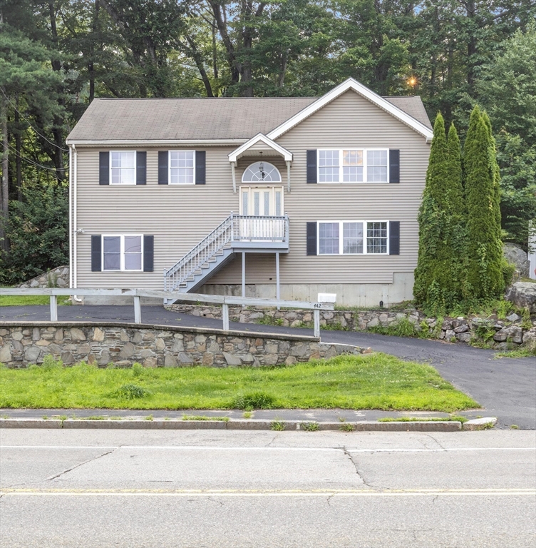 442 Lake Avenue Worcester, MA 01604 - Photo 4 of 14 a front view of a house with a yard and garage