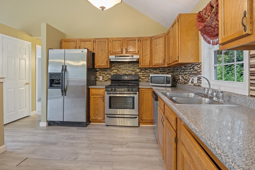 442 Lake Avenue Worcester, MA 01604 - Photo 5 of 14 a kitchen with a sink stove and refrigerator
