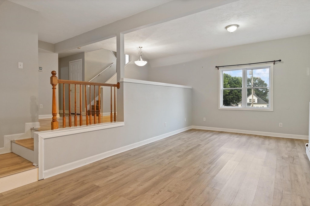 442 Lake Avenue Worcester, MA 01604 - Photo 7 of 14 a view of an empty room with wooden floor and a window