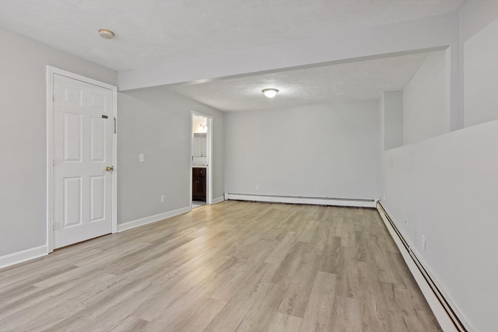 442 Lake Avenue Worcester, MA 01604 - Photo 10 of 14 wooden floor in an empty room with a window