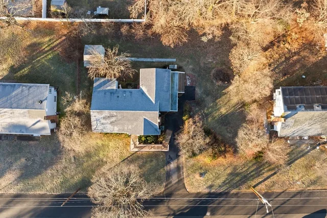 an aerial view of residential houses with outdoor space