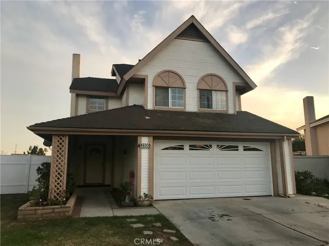 a front view of a house with a garage