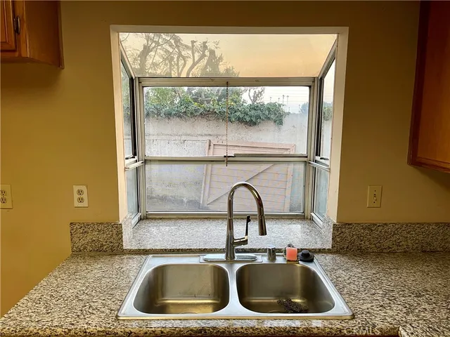 a kitchen with a sink and a window