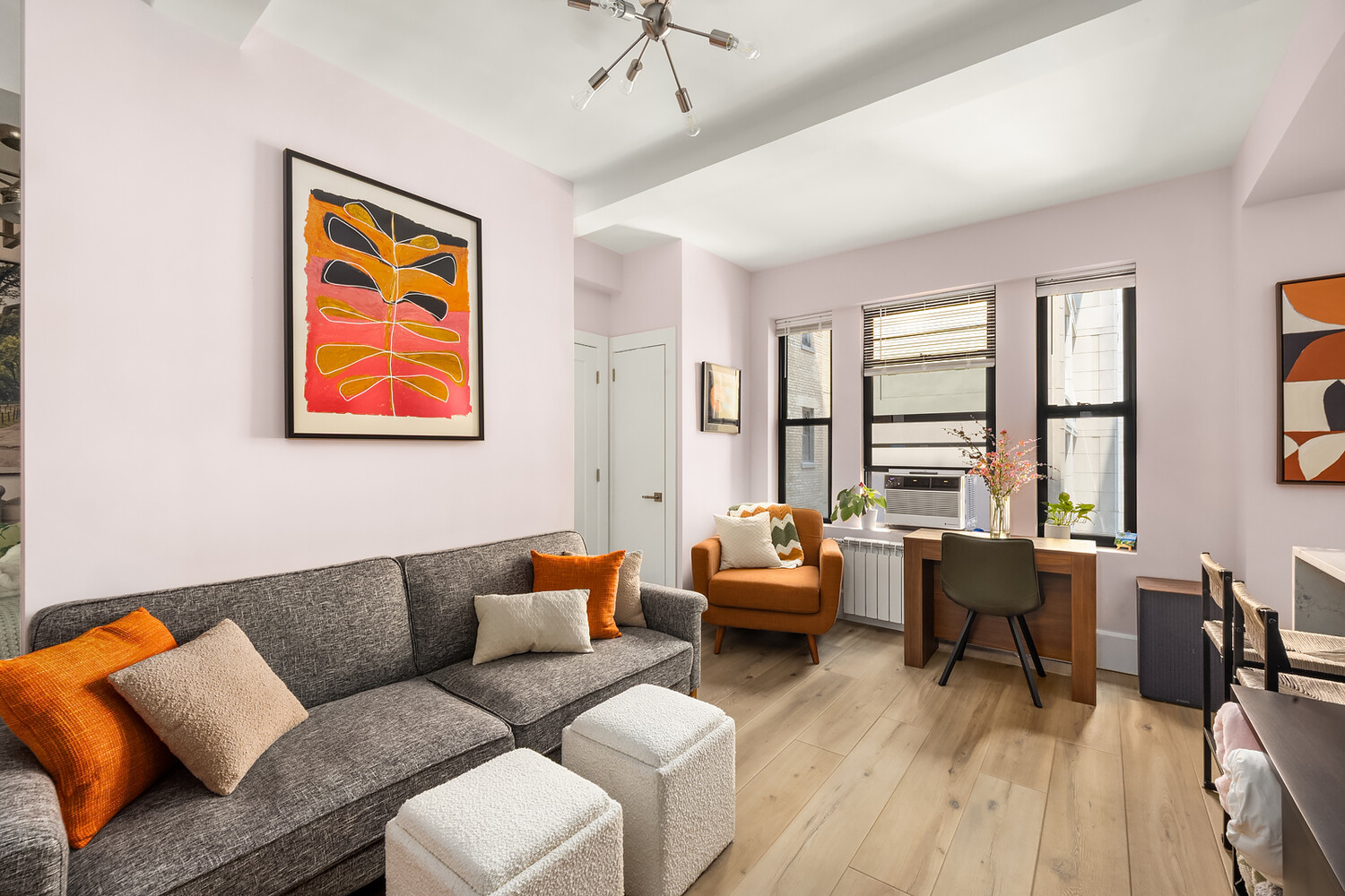 215 West 75th Street, Unit 9E Manhattan, NY 10023 - Photo 1 of 10 a living room with furniture and a large window