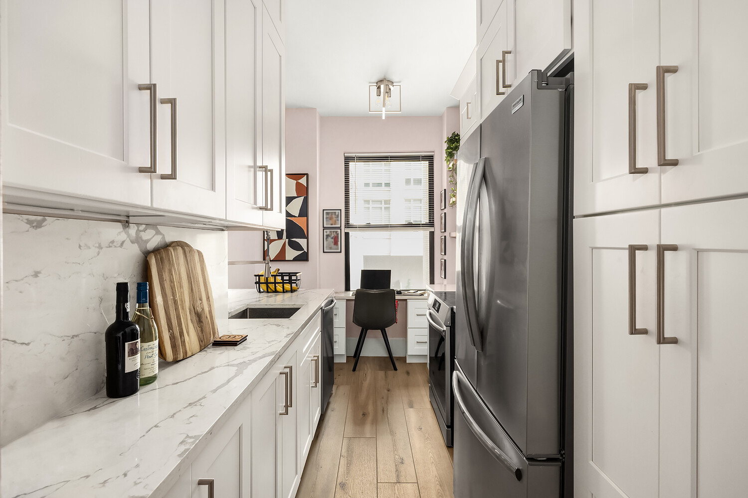 215 West 75th Street, Unit 9E Manhattan, NY 10023 - Photo 5 of 10 a kitchen with stainless steel appliances granite countertop a refrigerator and a stove