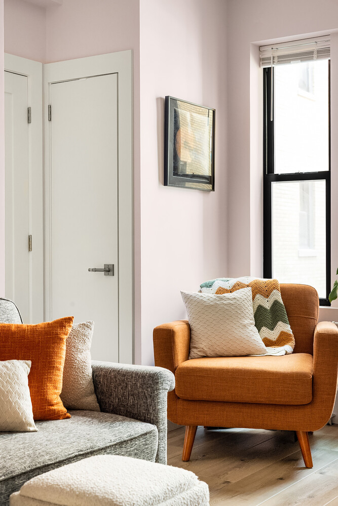 215 West 75th Street, Unit 9E Manhattan, NY 10023 - Photo 7 of 10 a living room with furniture and a window