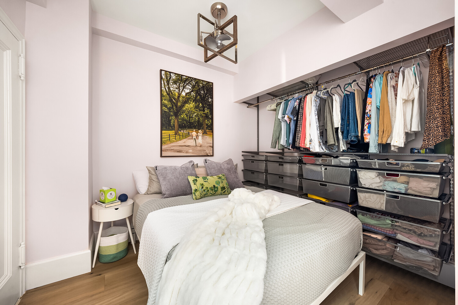 215 West 75th Street, Unit 9E Manhattan, NY 10023 - Photo 8 of 10 a bedroom with a bed a dresser and windows