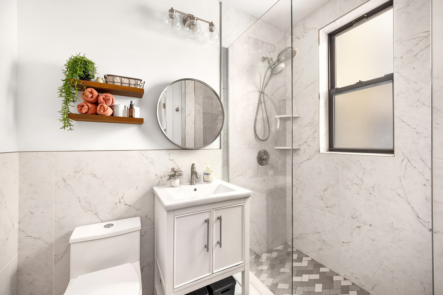 215 West 75th Street, Unit 9E Manhattan, NY 10023 - Photo 9 of 10 a bathroom with a toilet a sink and a mirror