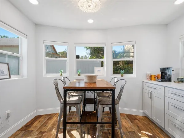 a view of a dining room with furniture and window