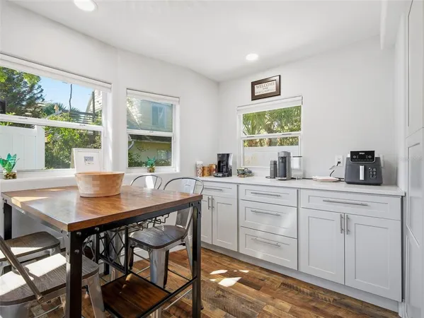 a kitchen with a table and chairs in it