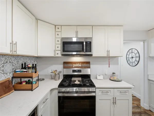 a spacious bathroom with a sink and a mirror