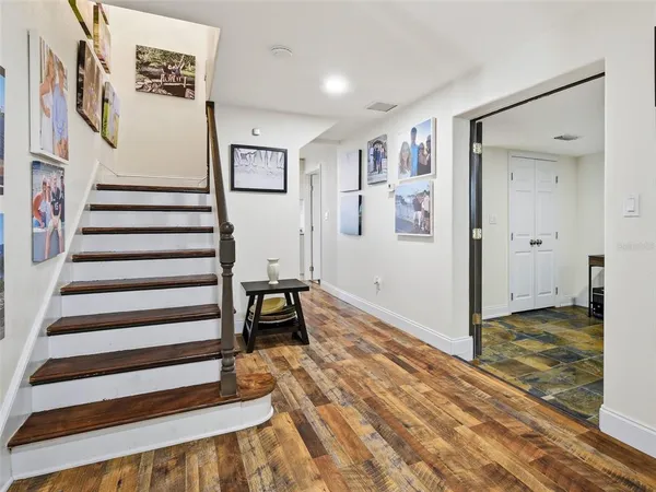 a bedroom with furniture and flat screen tv