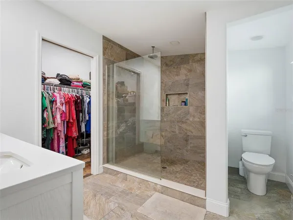 a bathroom with a double vanity sink and mirror