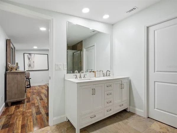 a view of an entryway with wooden floor
