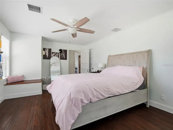 a bathroom with a toilet a sink and a mirror