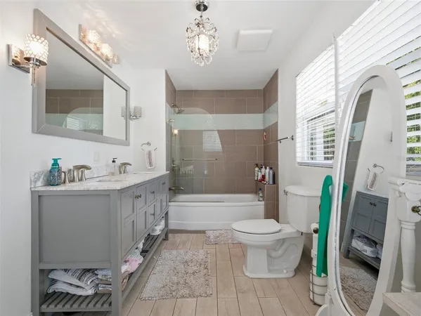 a living room with lots of furniture and a flat screen tv