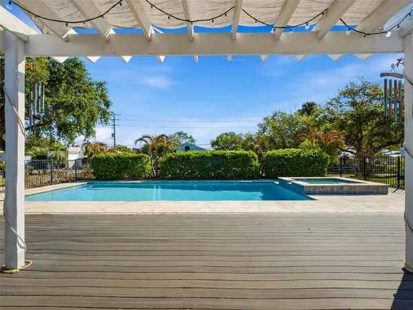 a view of a patio with table and chairs with wooden floor