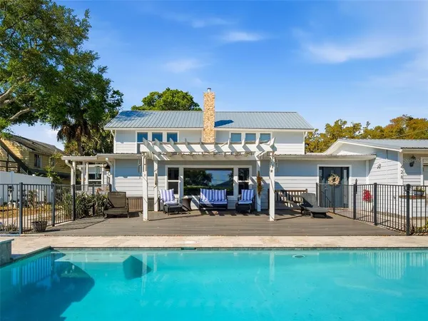 a view of a house with swimming pool
