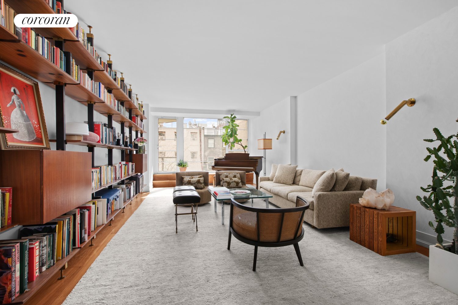a living room with furniture a bookshelf and a book shelf