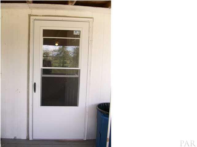 11380 6 Pack Road Milton, FL 32583 - Photo 20 of 22 Back door to show new storm door with screen. Front door has new storm door also!