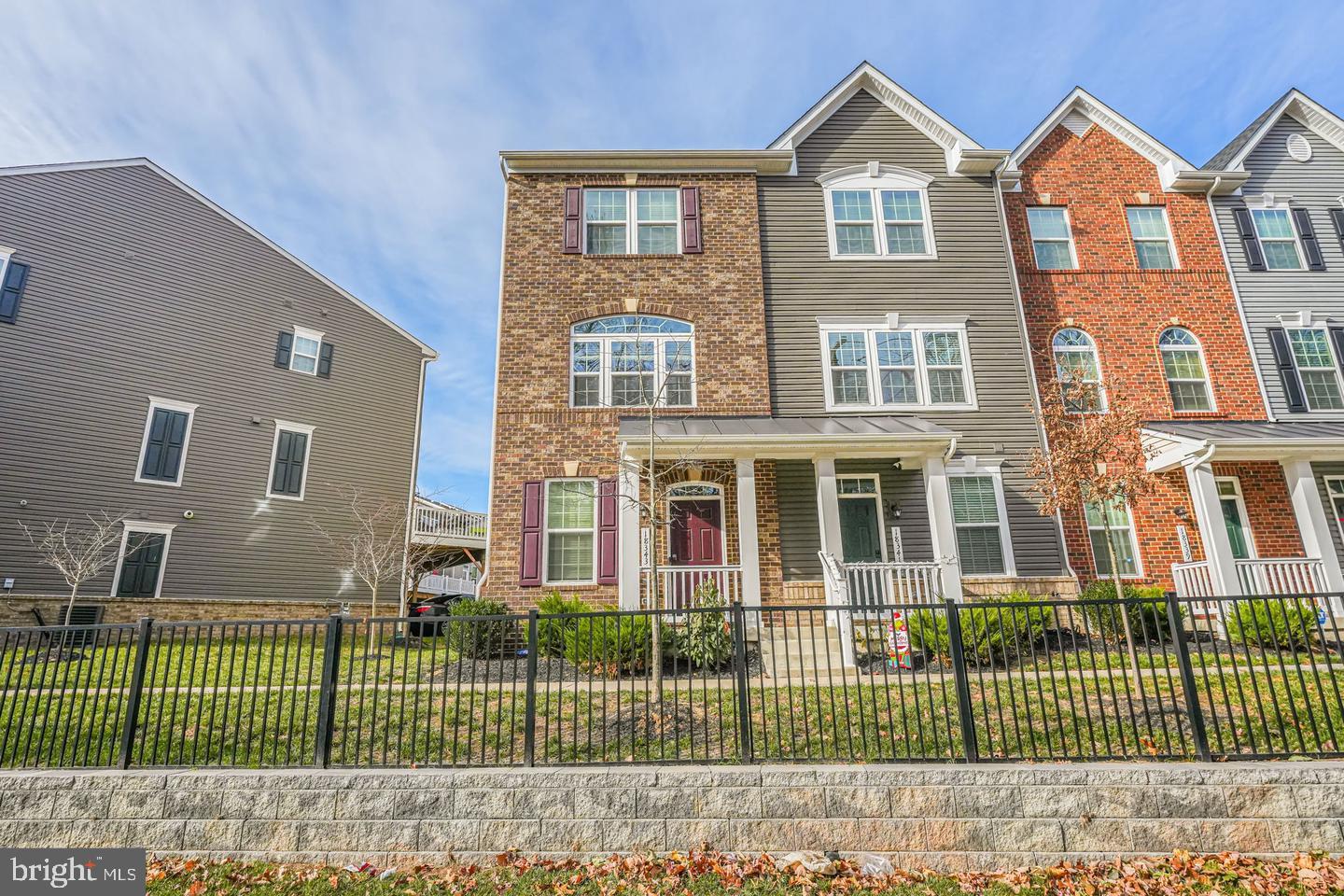 18339 Reaper Hl Court Triangle, VA 22172 - Photo 1 of 34 a view of a brick house with a small yard