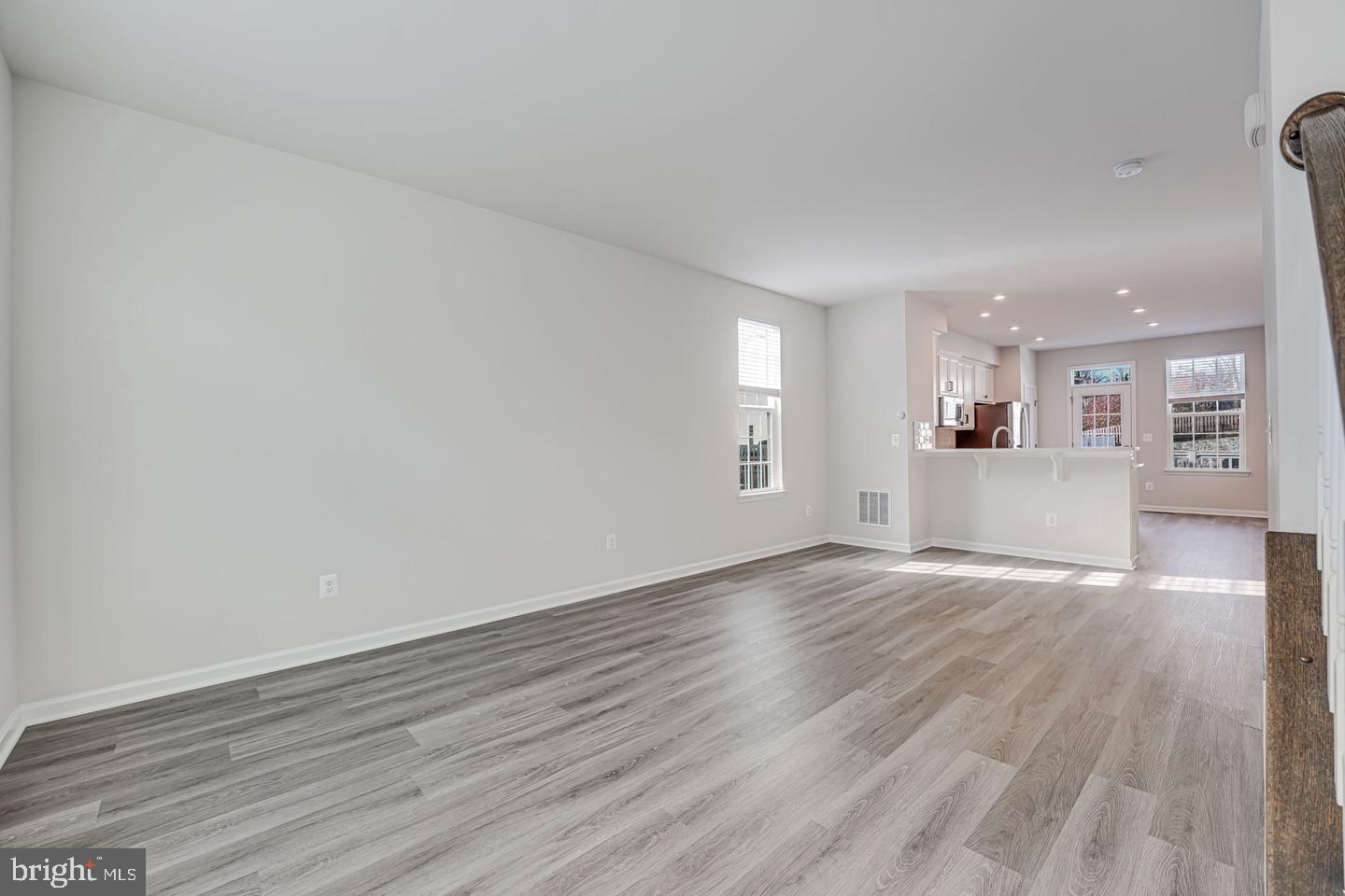 18339 Reaper Hl Court Triangle, VA 22172 - Photo 11 of 34 a view of a kitchen with wooden floor and a window