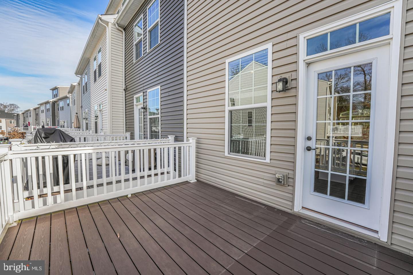 18339 Reaper Hl Court Triangle, VA 22172 - Photo 13 of 34 a view of a wooden balcony with a barbeque