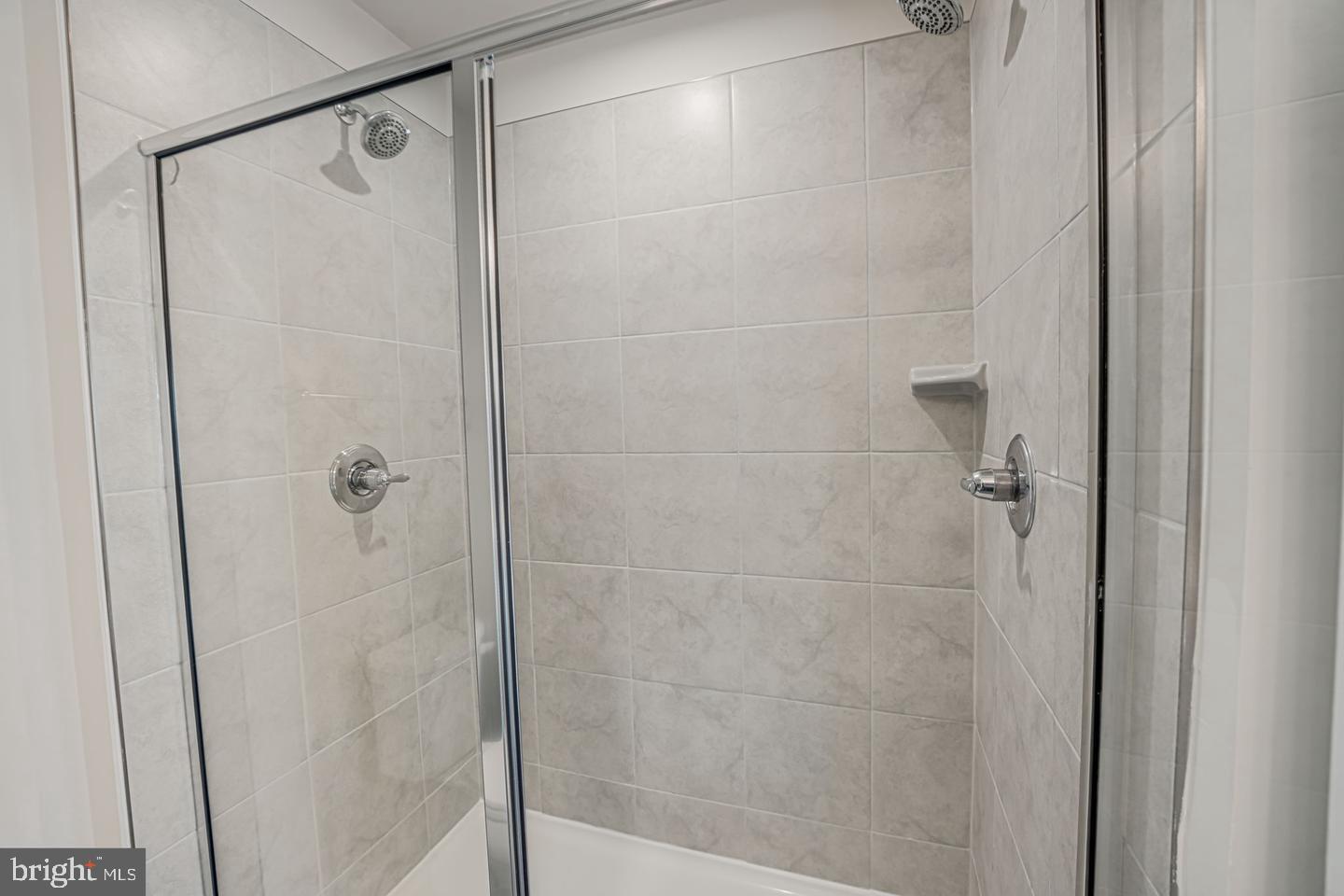 18339 Reaper Hl Court Triangle, VA 22172 - Photo 15 of 34 a bathroom with a shower