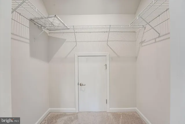 a view of a room with racks on the wall