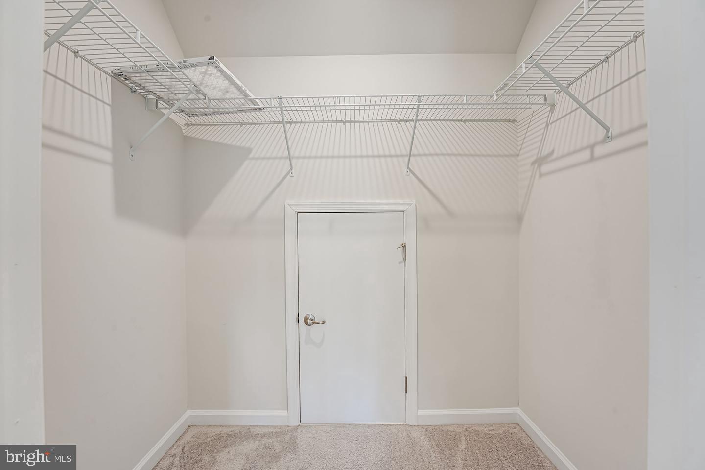 18339 Reaper Hl Court Triangle, VA 22172 - Photo 18 of 34 a view of a room with racks on the wall