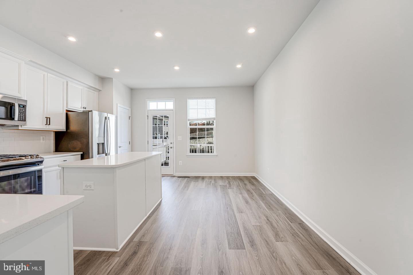 18339 Reaper Hl Court Triangle, VA 22172 - Photo 23 of 34 a view of kitchen with sink microwave refrigerator and cabinets