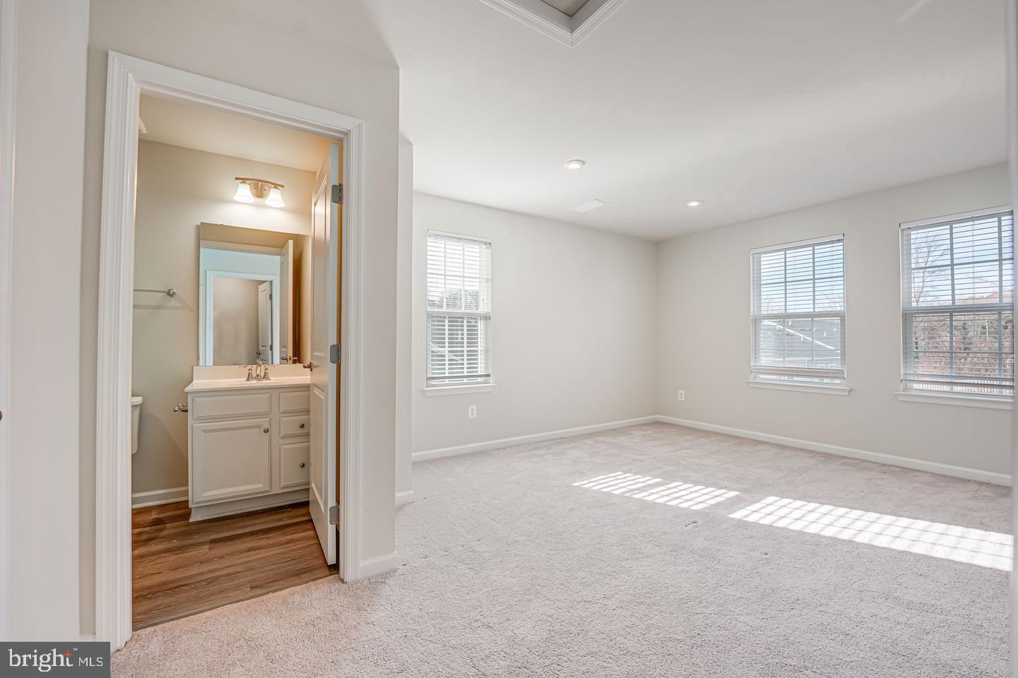18339 Reaper Hl Court Triangle, VA 22172 - Photo 25 of 34 wooden floor in an empty room with a window