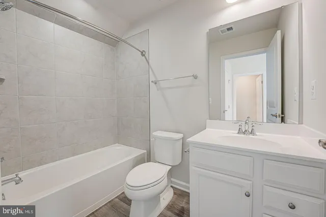 a bathroom with a sink a toilet and a bathtub