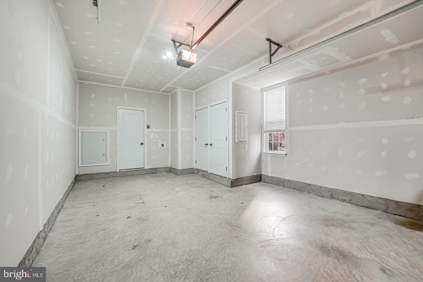 18339 Reaper Hl Court Triangle, VA 22172 - Photo 32 of 34 an empty room with staircase and white walls