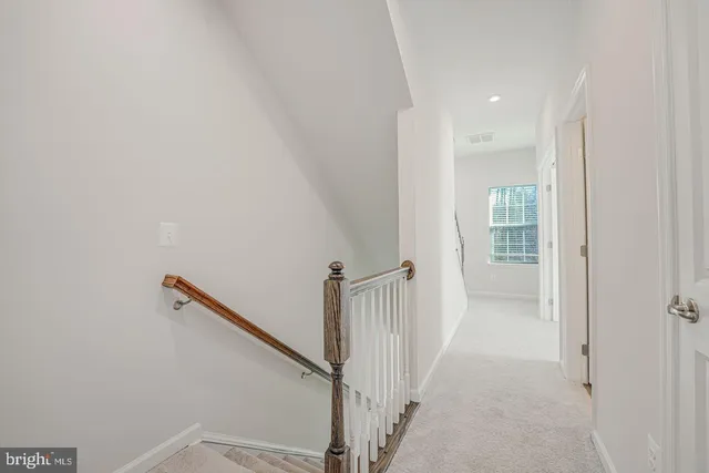 a view of hallway with stairs