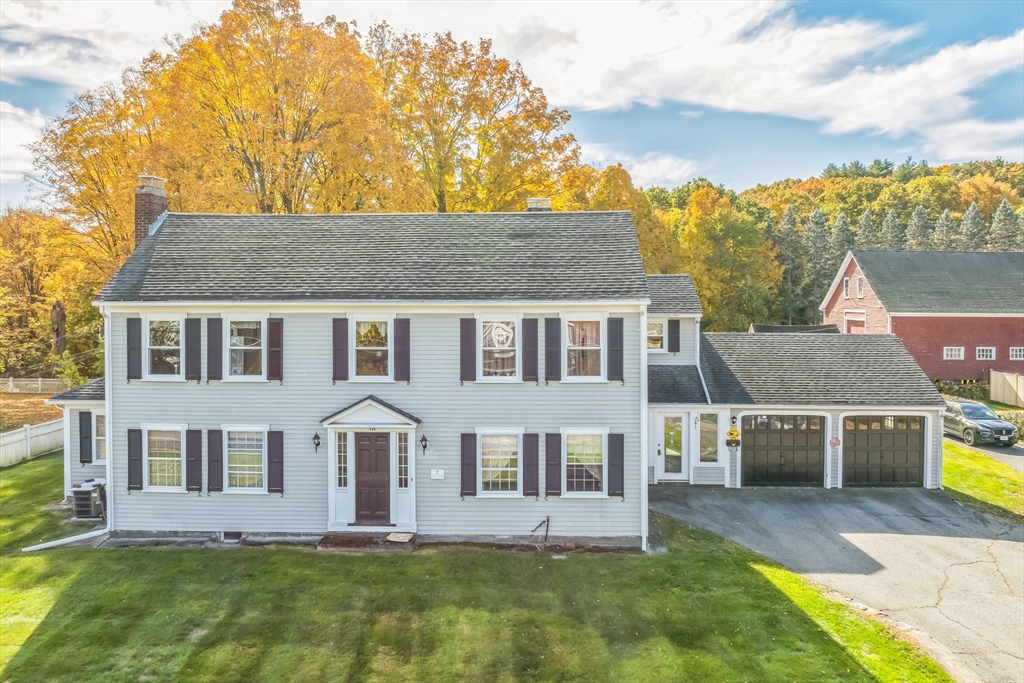 114 Summer Street Maynard, MA 01754 - Photo 1 of 32 a front view of a house with a yard