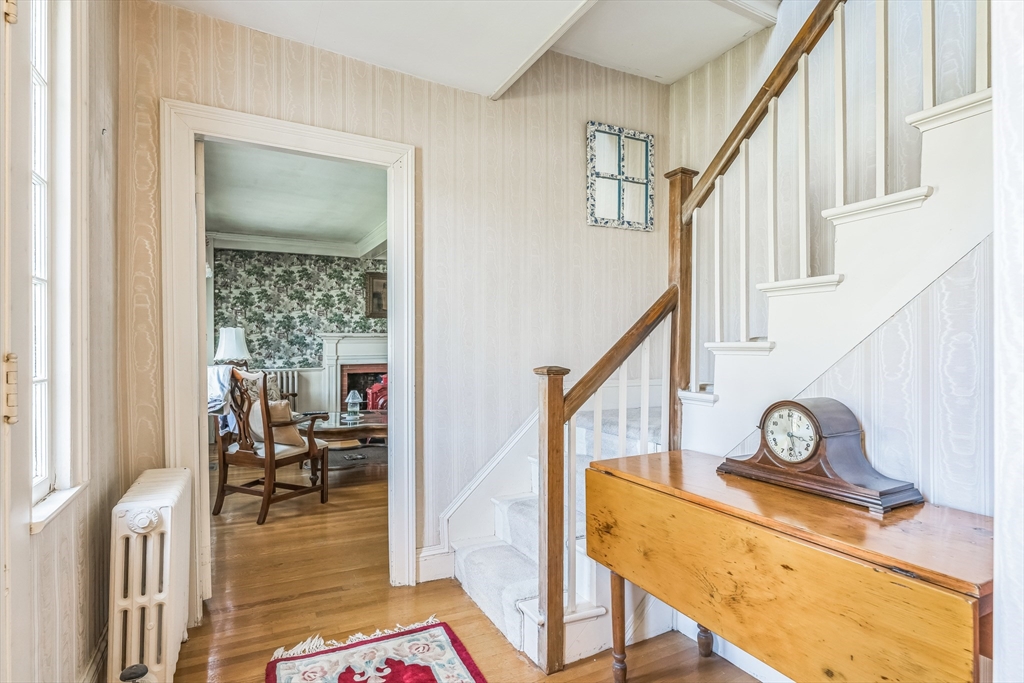 114 Summer Street Maynard, MA 01754 - Photo 12 of 32 a view of entryway and hall with wooden floor