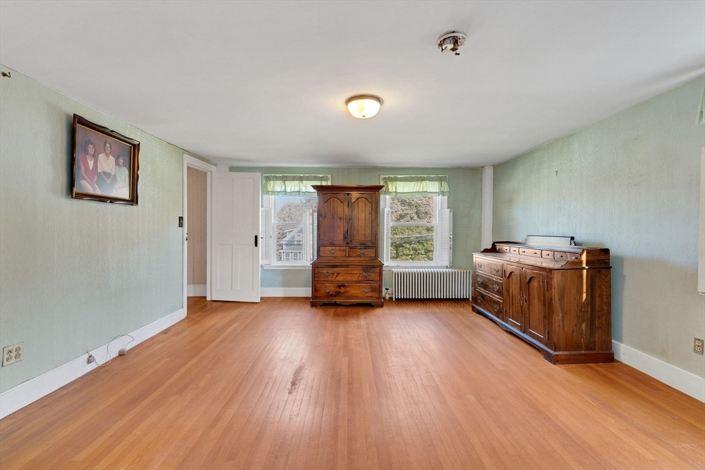 114 Summer Street Maynard, MA 01754 - Photo 13 of 32 a big room with wooden floor and windows