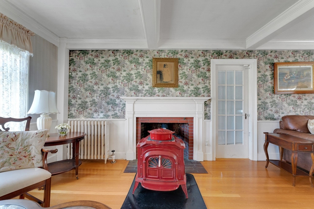 114 Summer Street Maynard, MA 01754 - Photo 14 of 32 a living room with furniture and a fireplace