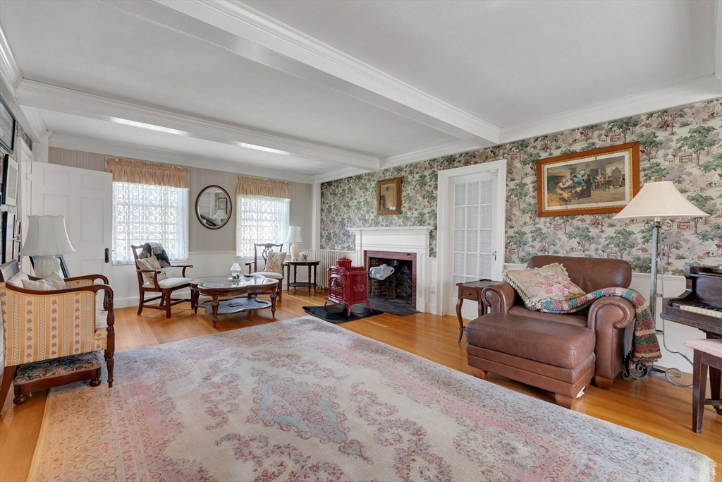 114 Summer Street Maynard, MA 01754 - Photo 15 of 32 a living room with furniture and a fireplace