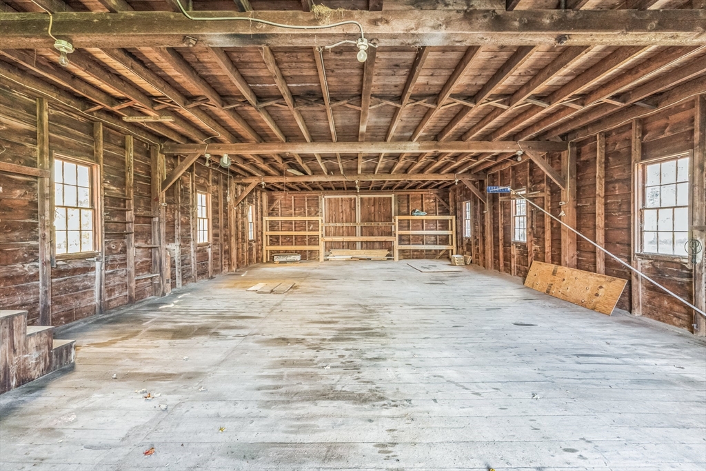 114 Summer Street Maynard, MA 01754 - Photo 18 of 32 a view of an empty room with wooden walls